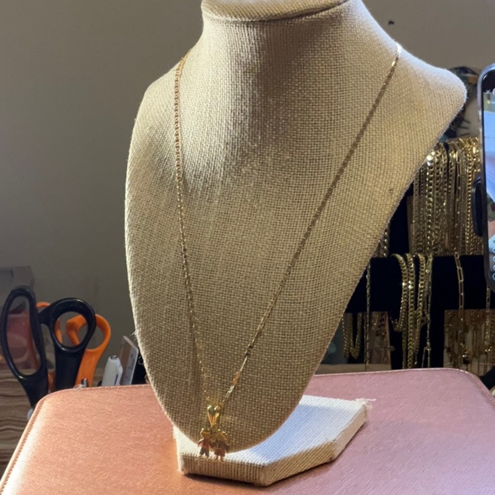 A Diamond Cut Necklace With The Boy And Girl Charm 14K Gold plated